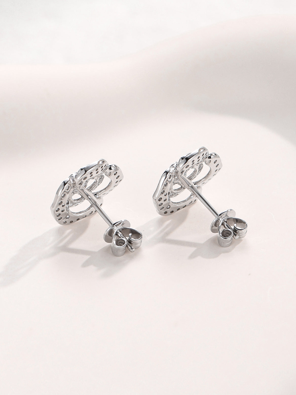 Back view of camellia diamond stud earrings with push-back closure