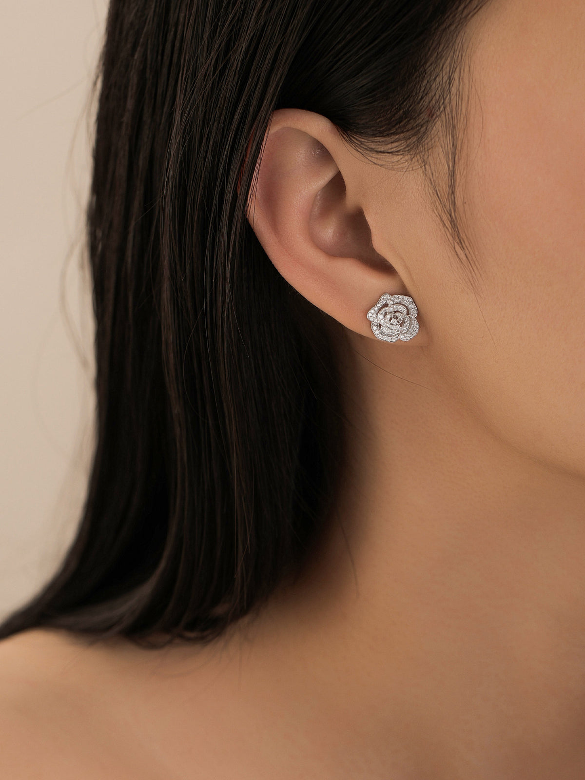 Camellia lab-grown diamond stud earring worn on the ear