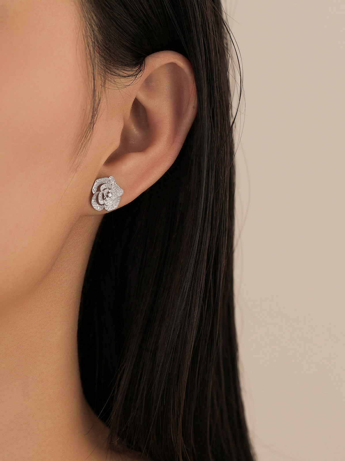 Camellia lab-grown diamond stud earring worn on the ear