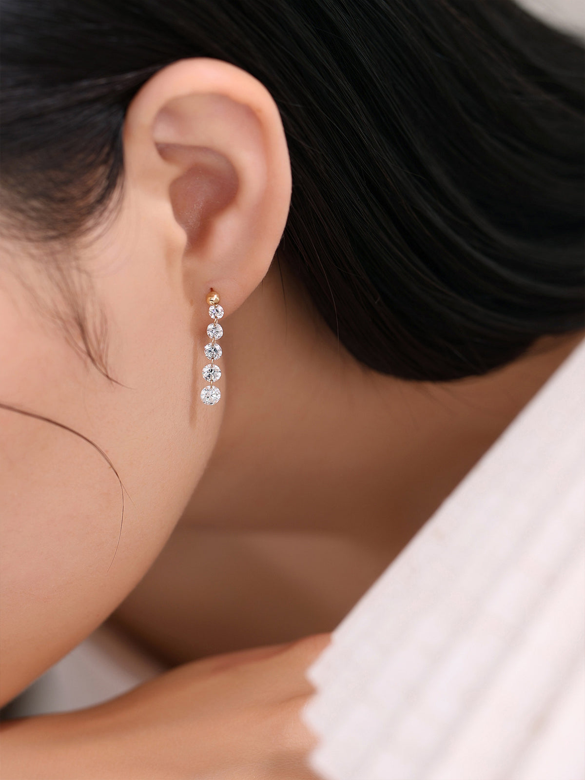 DANFÉE 18K gold diamond drop earrings on model, side view