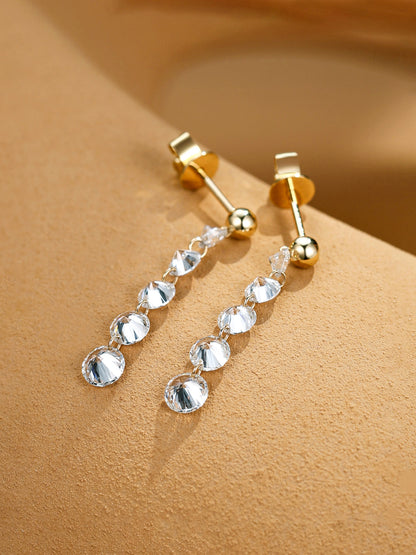 Graduated round lab-grown diamond drop earrings close-up