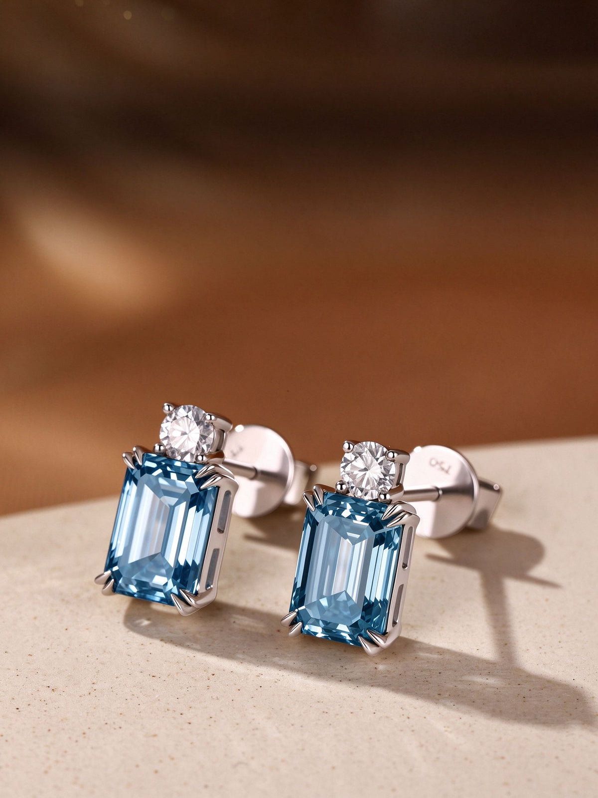 Fancy vivid blue emerald-cut lab-grown diamond stud earrings with round diamond accent
