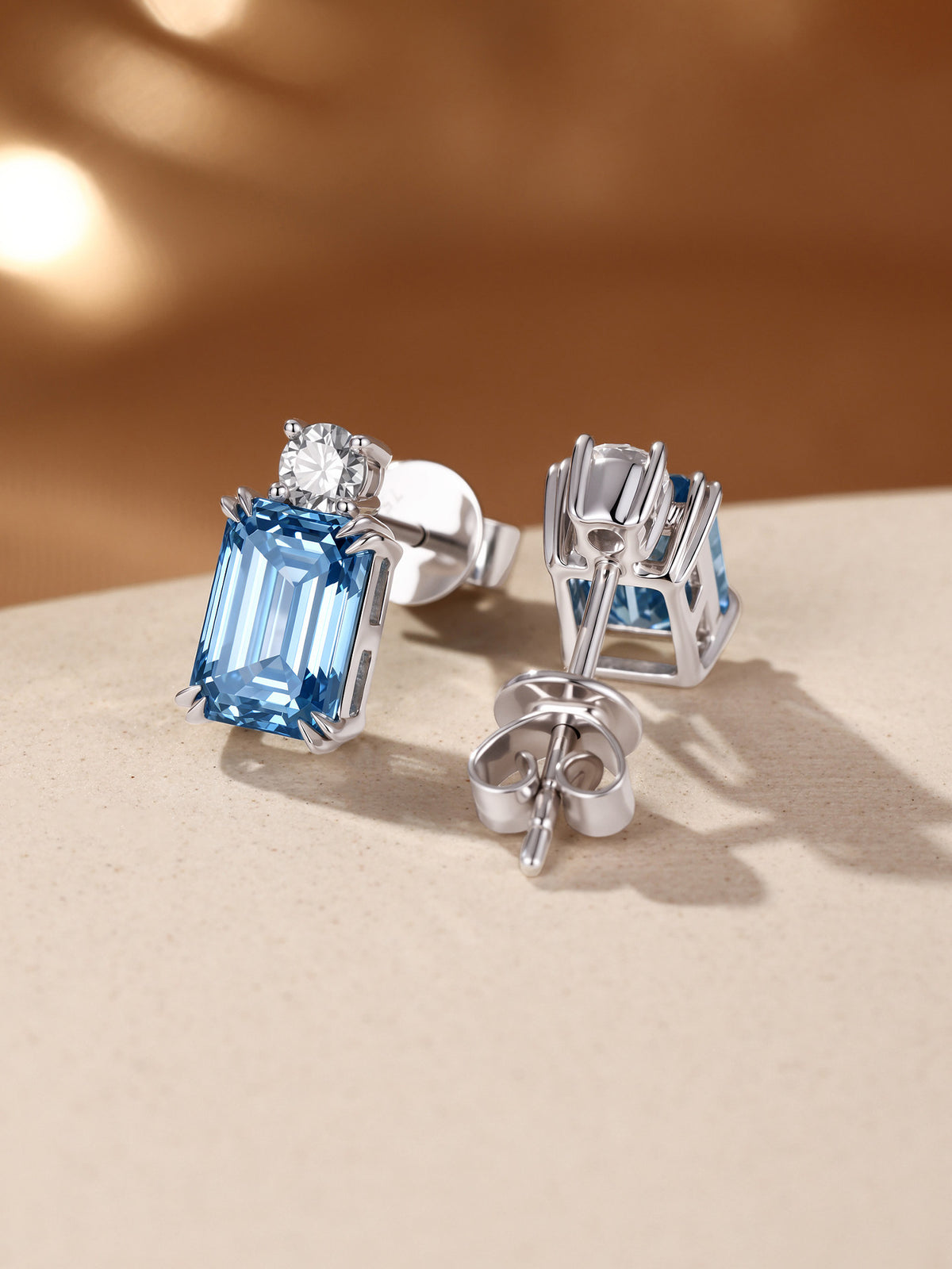 Back view of 18K white gold blue diamond stud earrings with push back