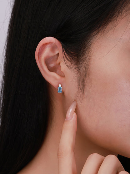 Everyday wear of blue emerald-cut lab-grown diamond stud earrings