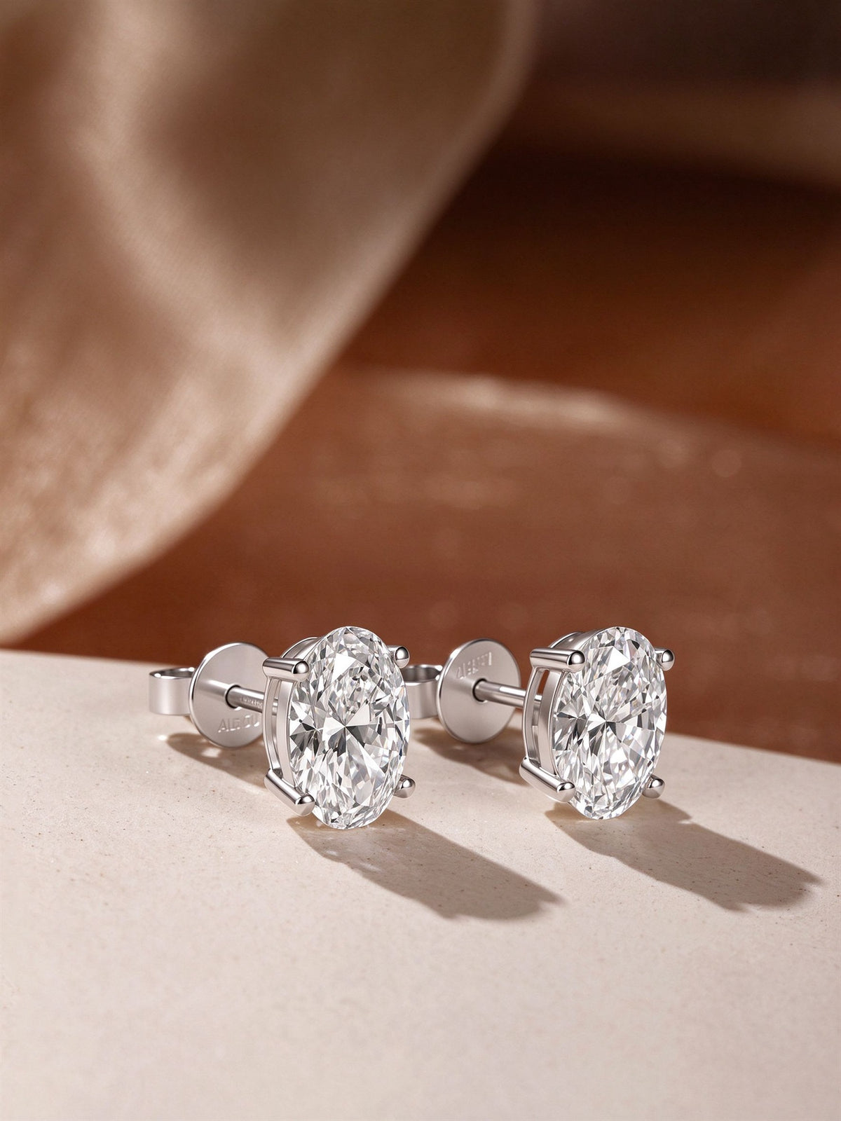 Céleste oval lab-grown diamond stud earrings in 18K white gold with butterfly backs