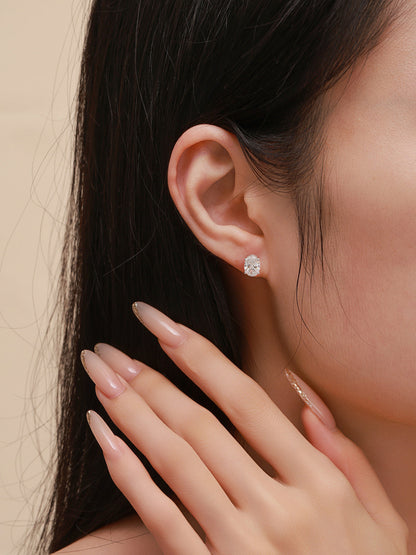 Céleste oval lab-grown diamond stud earring on the ear, close-up