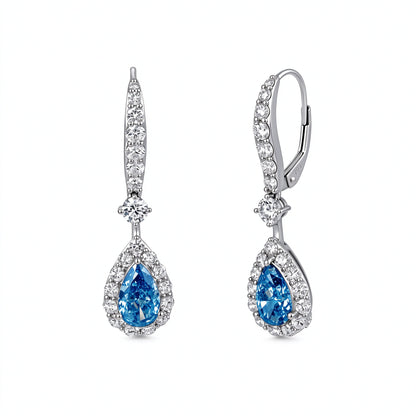 DANFÉE Céleste pear-cut blue lab-grown diamond halo drop earrings in 18K white gold on white background