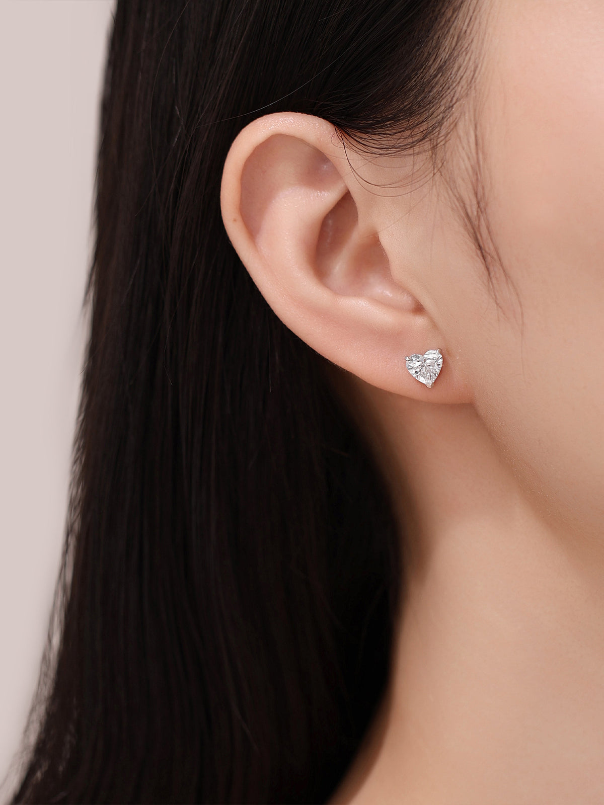 Heart-cut lab-grown diamond stud earring, on-ear scale