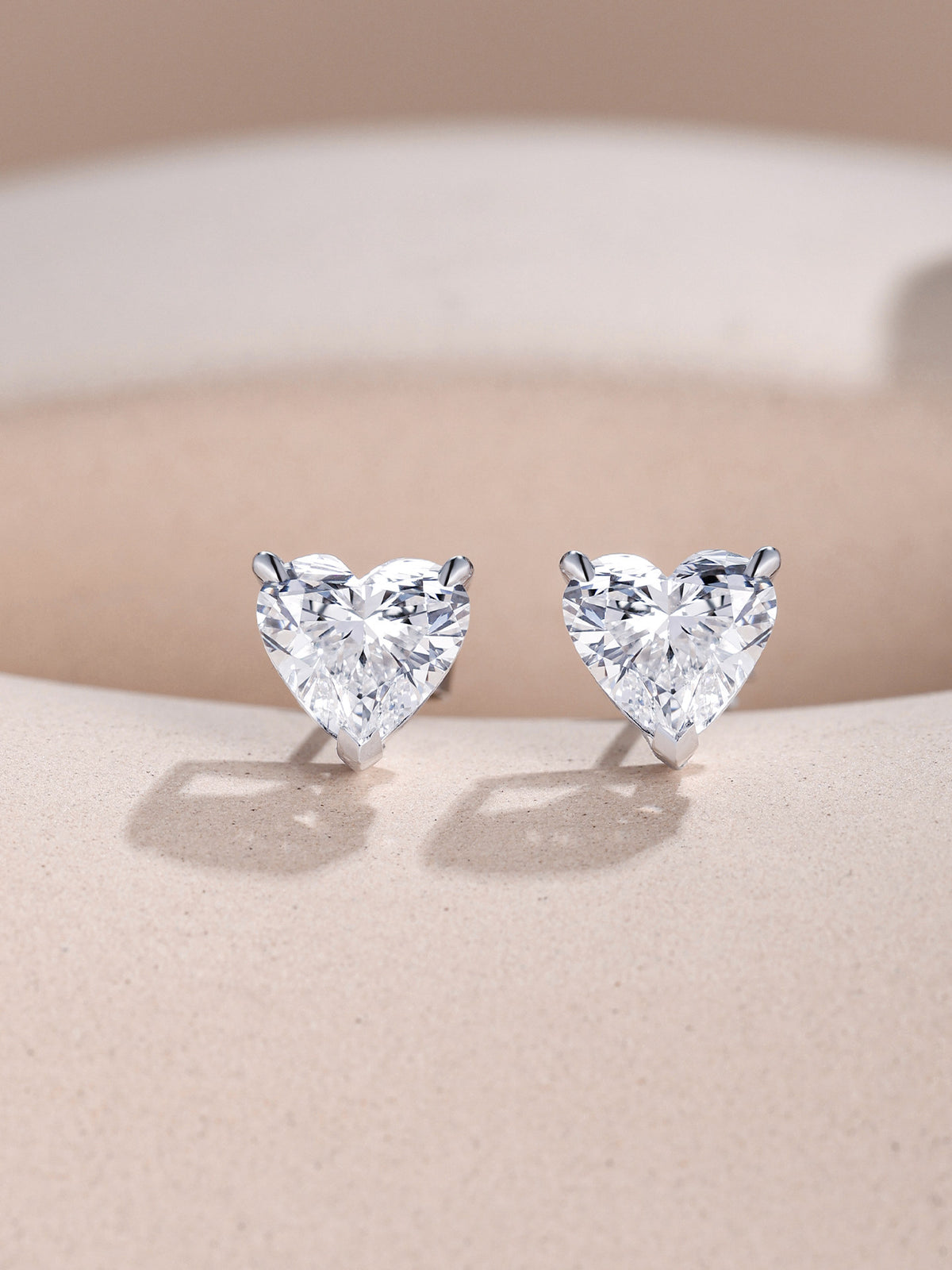 Pair of heart-cut lab-grown diamond solitaire studs, D-E colour, VVS clarity