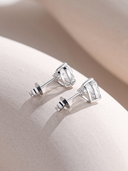 Heart diamond stud earrings in 18K white gold, profile view with push backs