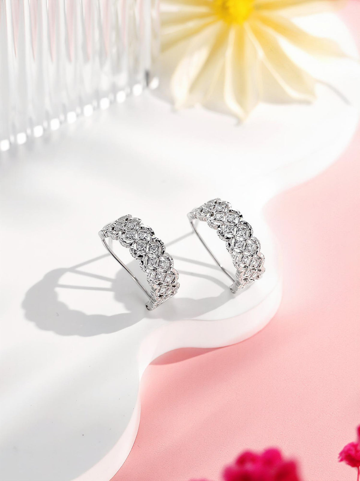 Dentelle lace diamond huggie earrings in PT950 platinum styled with flowers