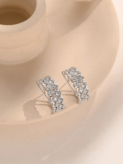 Openwork lace lattice platinum diamond huggie earrings on stone