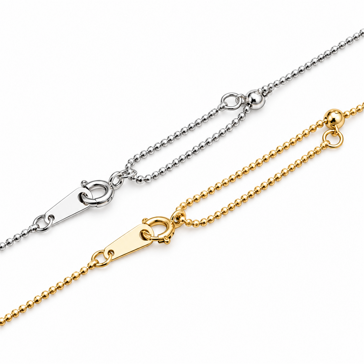 White and yellow gold bead chain clasps and tag details on white; digitally retouched supplier image