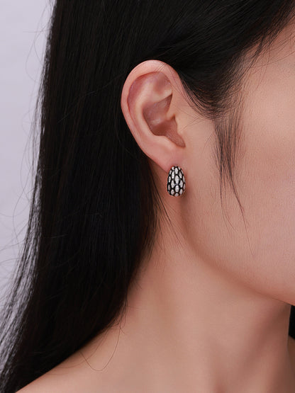 Écaille pavé diamond dome earring close-up on model