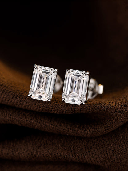 Emerald-cut lab-grown diamond stud earrings in 18K white gold on brown suede