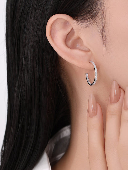 Model wearing the 20mm lab-grown diamond hoop earring in 18K white gold