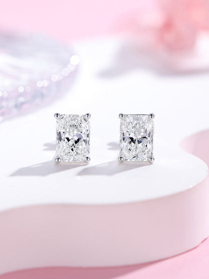 Radiant-cut lab-grown diamond stud earrings in 18K white gold on a soft pink backdrop