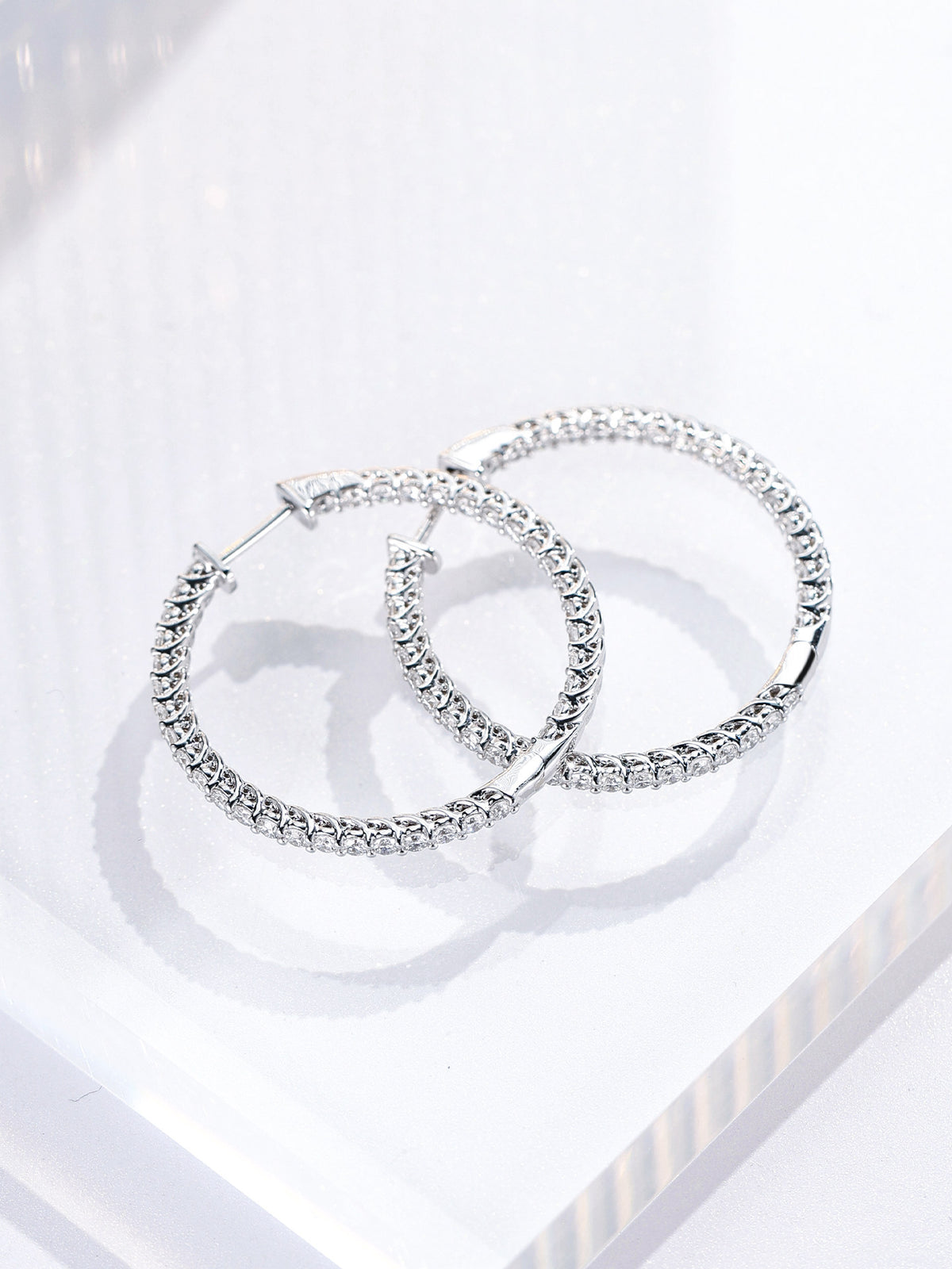 Lab-grown diamonds set on the outer and inner face of the 25mm hoop