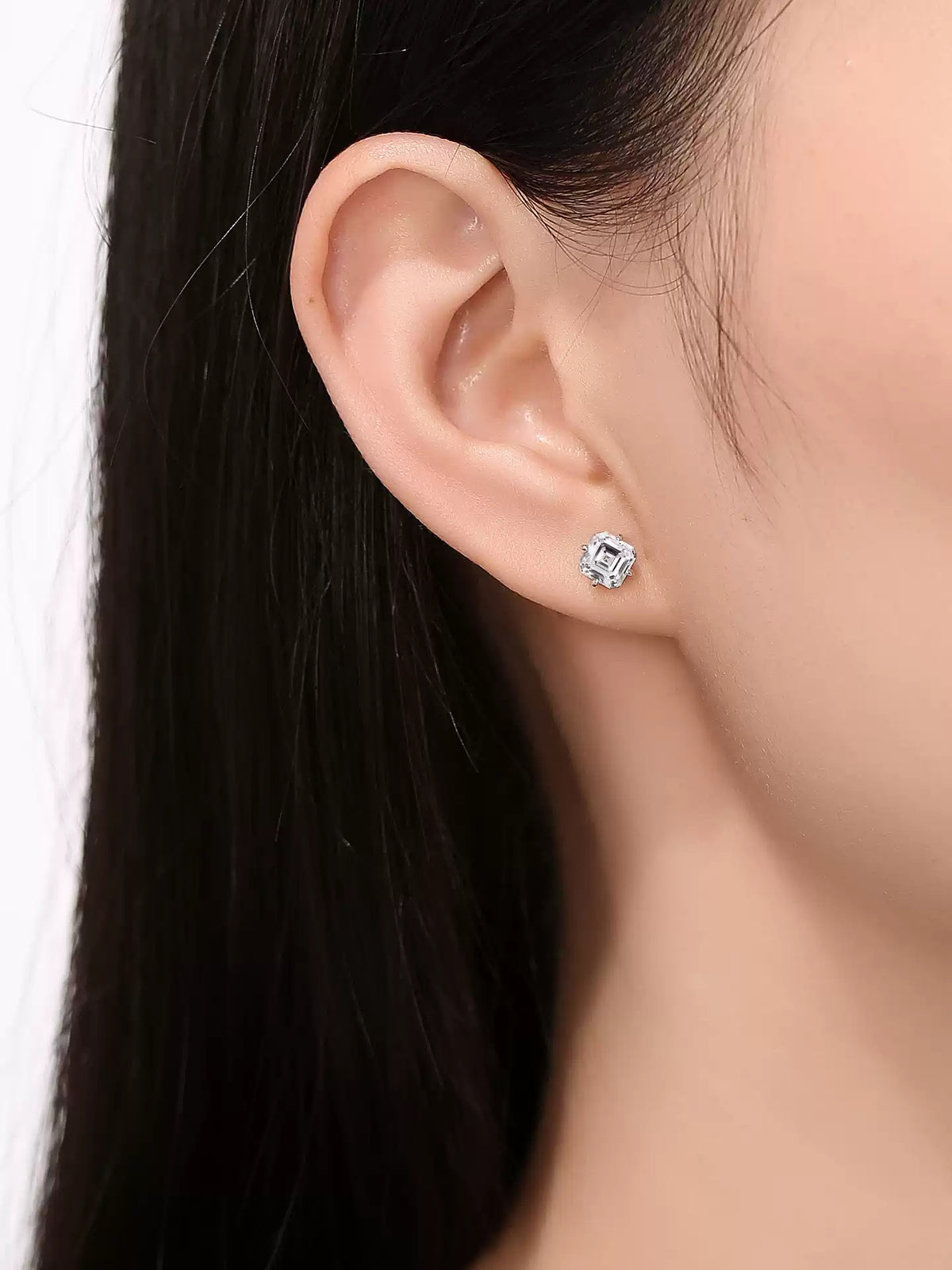 Side profile of the 1 carat Asscher-cut lab-grown diamond stud earring in 18K white gold worn on the ear