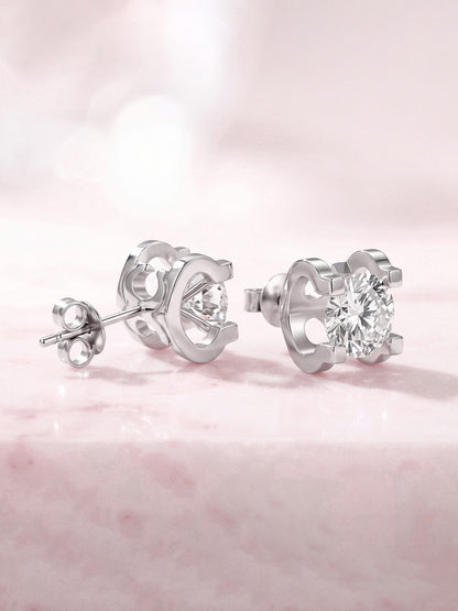 Side profile of 18K white gold solitaire stud showing open sculpted gallery and butterfly back