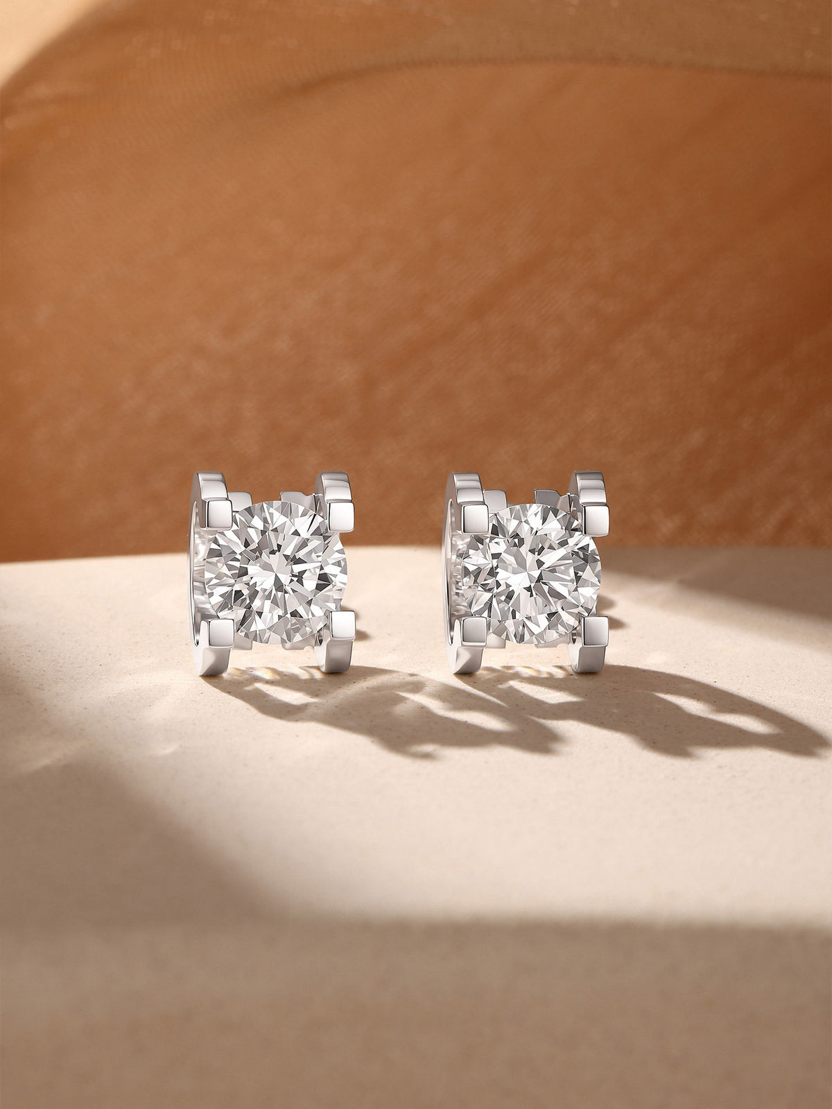 Pair of round brilliant lab-grown diamond studs in four-claw 18K white gold setting