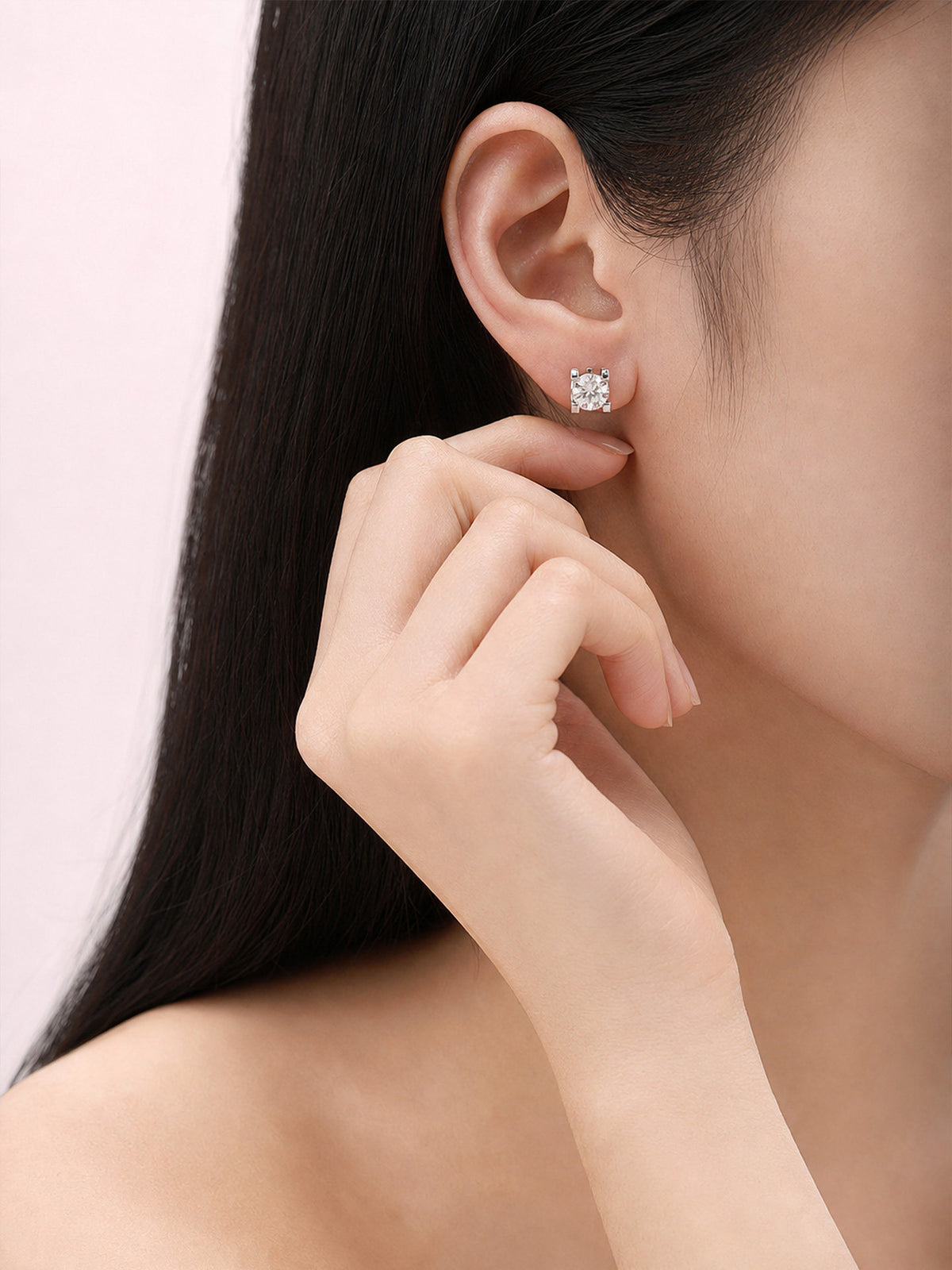 Solitaire diamond stud earring worn on the earlobe