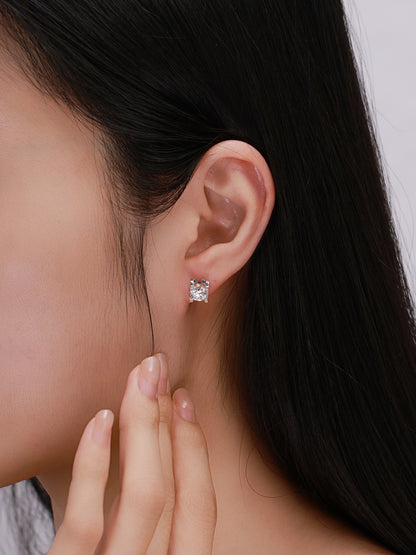 Close-up of four-claw lab-grown diamond stud earring on model