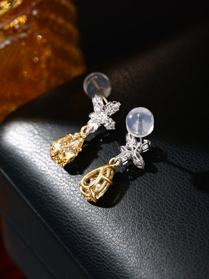 Floraison yellow diamond drop earrings showing claw settings and silicone backs
