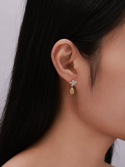 Floraison yellow diamond drop earring worn on the ear
