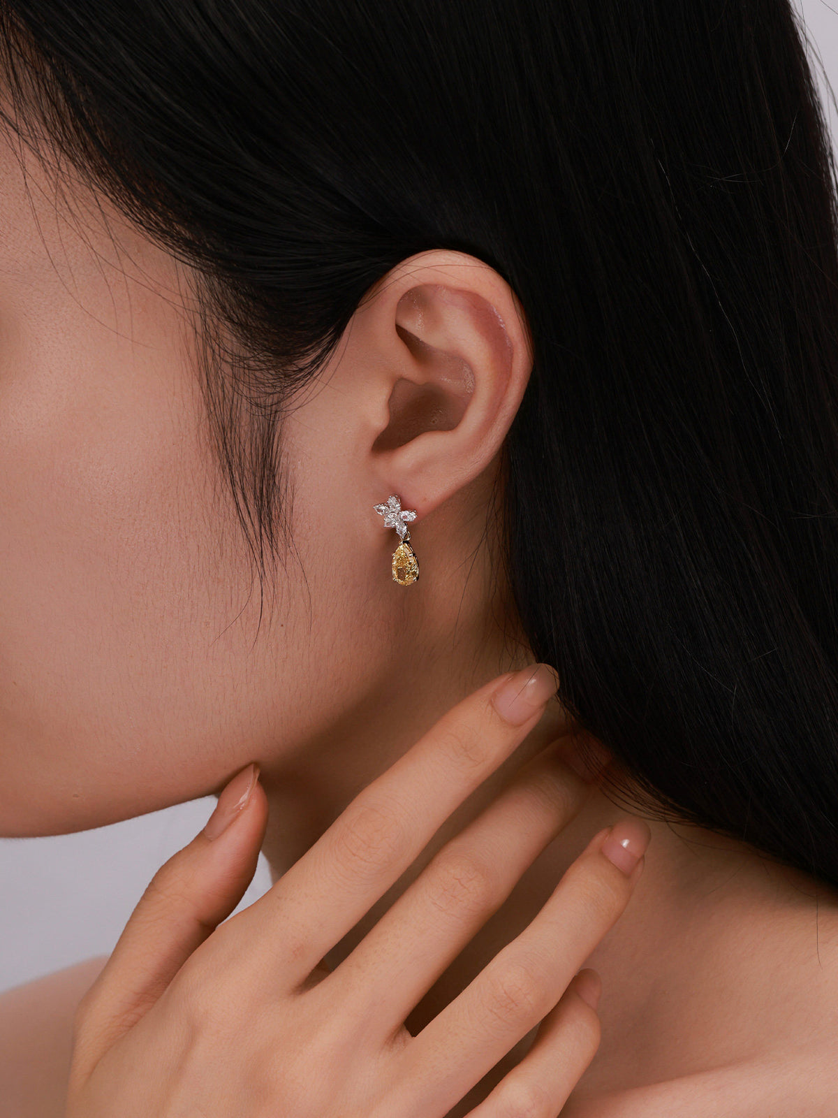Model wearing Floraison 2 carat fancy yellow lab-grown diamond drop earrings
