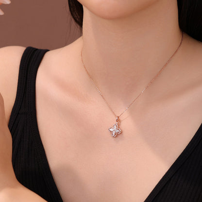 Model wearing the DANFÉE Kaleidoscope clover lab-grown diamond necklace at the collarbone
