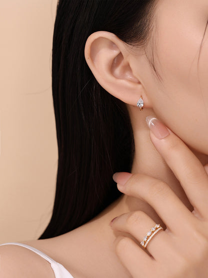 18K gold pear diamond huggie earring styled with a diamond ring