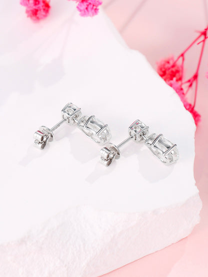 Back view of 18K gold claw settings and push-back butterfly closures