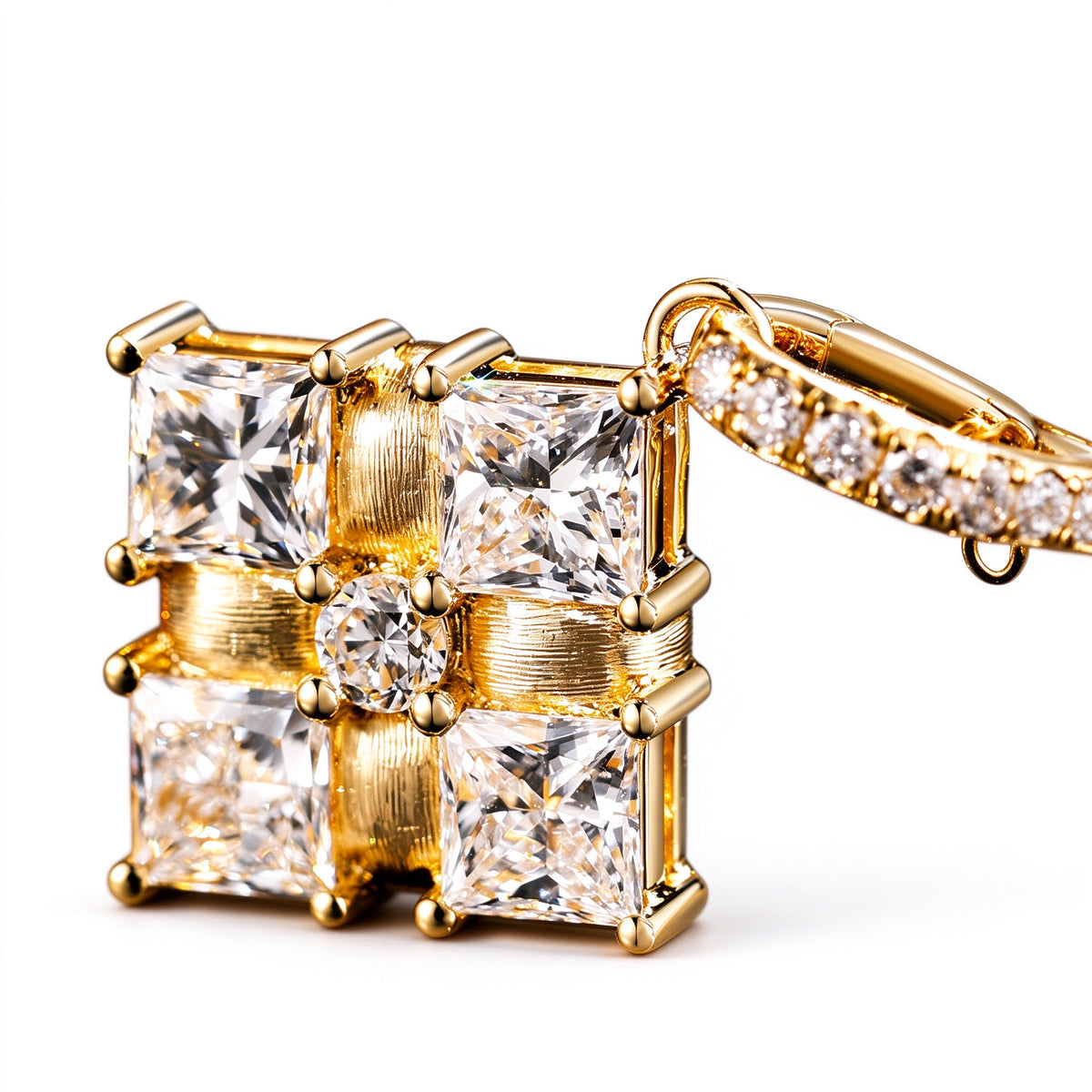 Close-up of princess-cut lab-grown diamonds and brushed gold ribbon bands