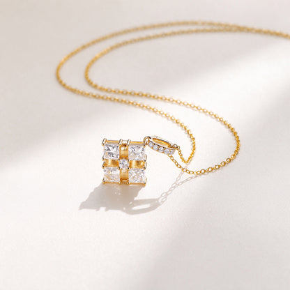 Ribbon Box diamond necklace resting on ivory fabric