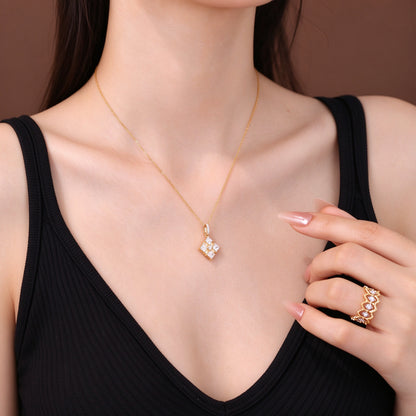 Ribbon Box 18K yellow gold diamond necklace on model with black neckline