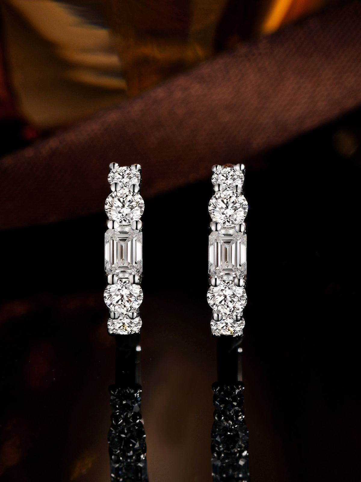 Pair of five-stone lab-grown diamond huggie earrings in PT950 platinum with emerald-cut centre stones