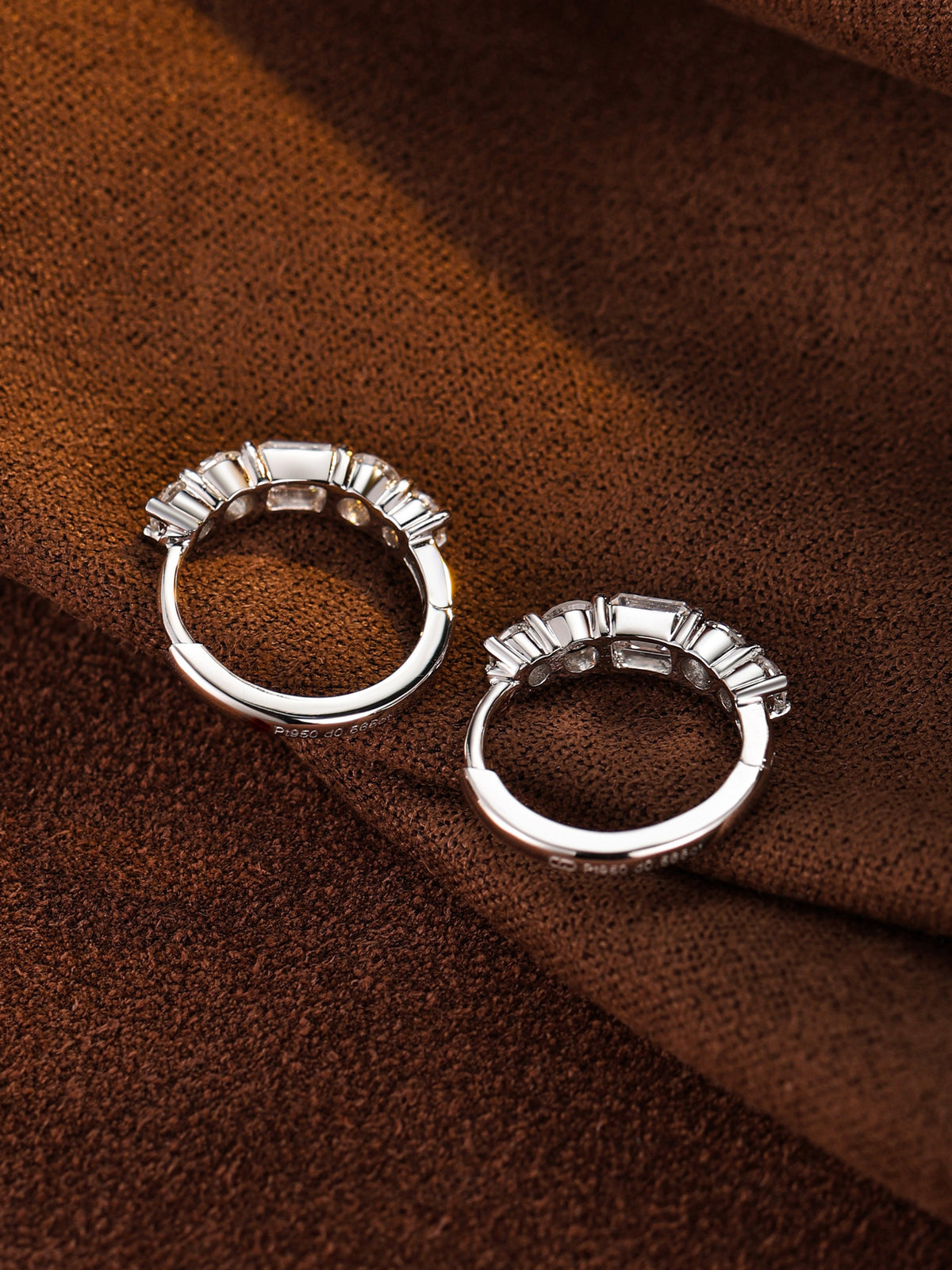 Inside of the PT950 platinum diamond huggie earrings showing the Pt950 hallmark and hinged clasp