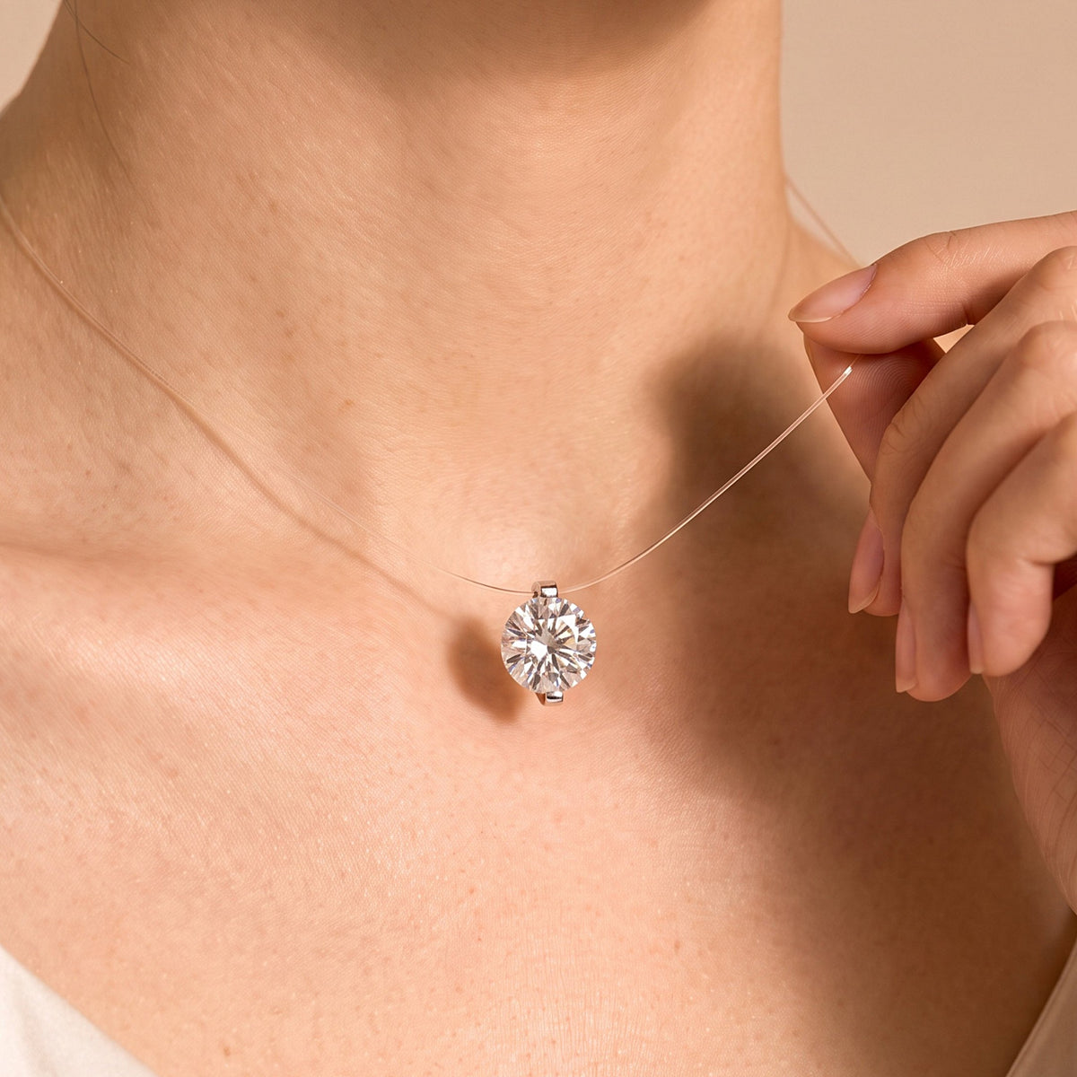Model wearing the DANFÉE floating lab-grown diamond necklace at the collarbone
