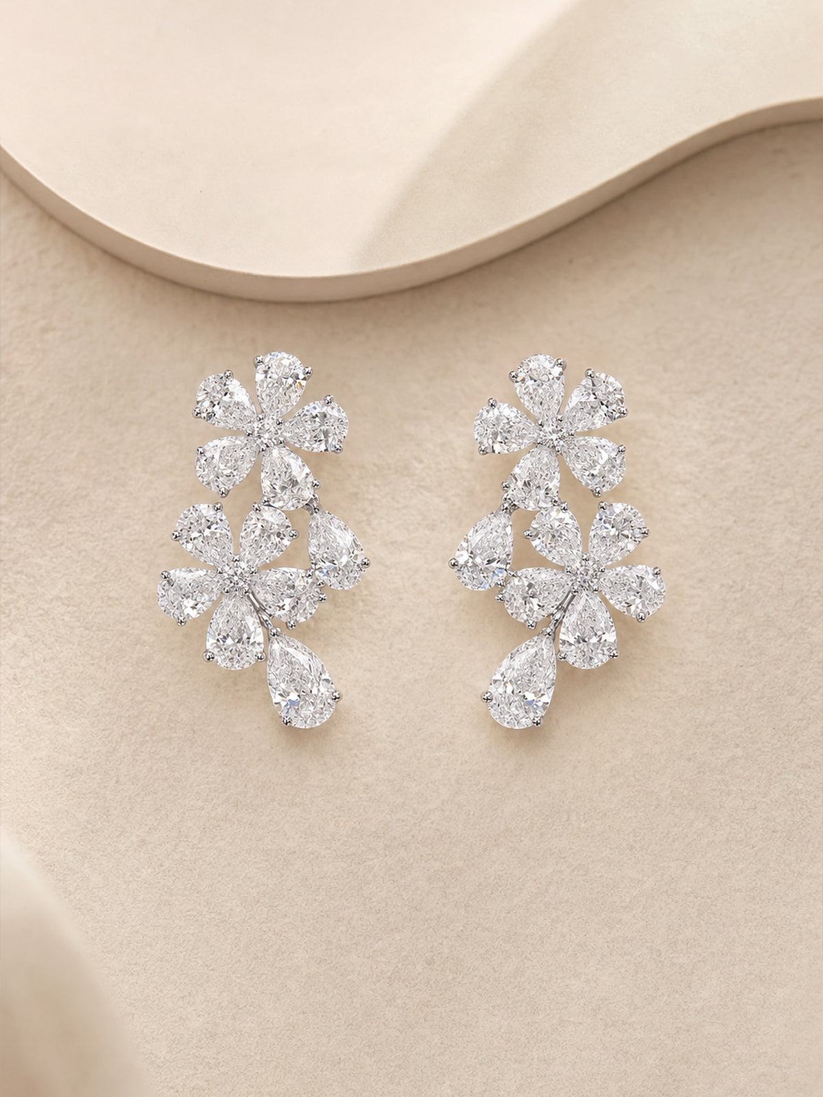 Pair of forget-me-not lab-grown diamond cluster earrings in 14K white gold with pear-shaped drops
