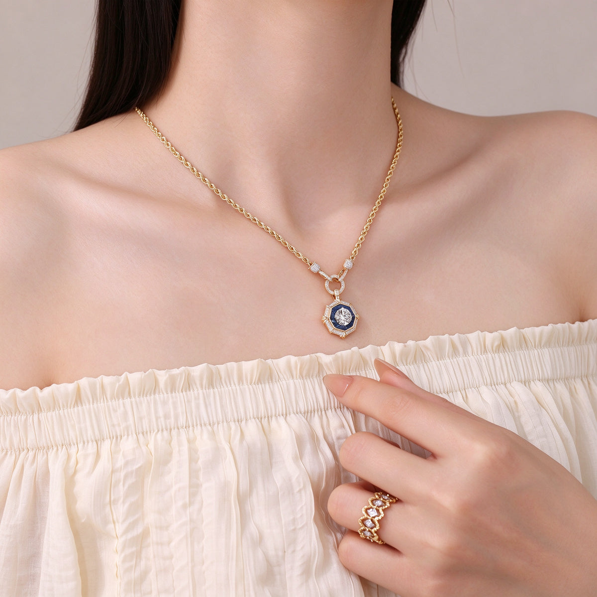 DANFÉE octagon halo diamond necklace in 18K yellow gold worn at the collarbone