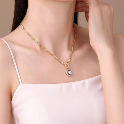 DANFÉE octagon halo diamond necklace worn with a blush satin camisole, side view