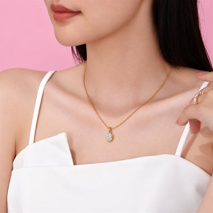 DANFÉE oval bezel lab-grown diamond necklace in 18K yellow gold worn with a white top