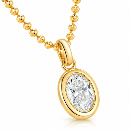 DANFÉE oval bezel diamond pendant in 18K yellow gold on white
