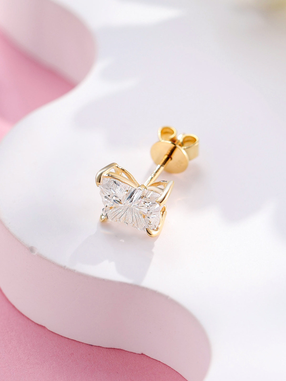 Butterfly-cut lab-grown diamond stud in 18K yellow gold with butterfly push back, angled view