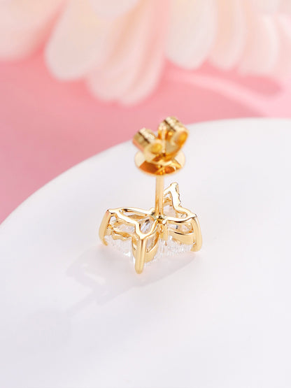 Back of 18K gold butterfly diamond stud showing the open butterfly gallery and four claws