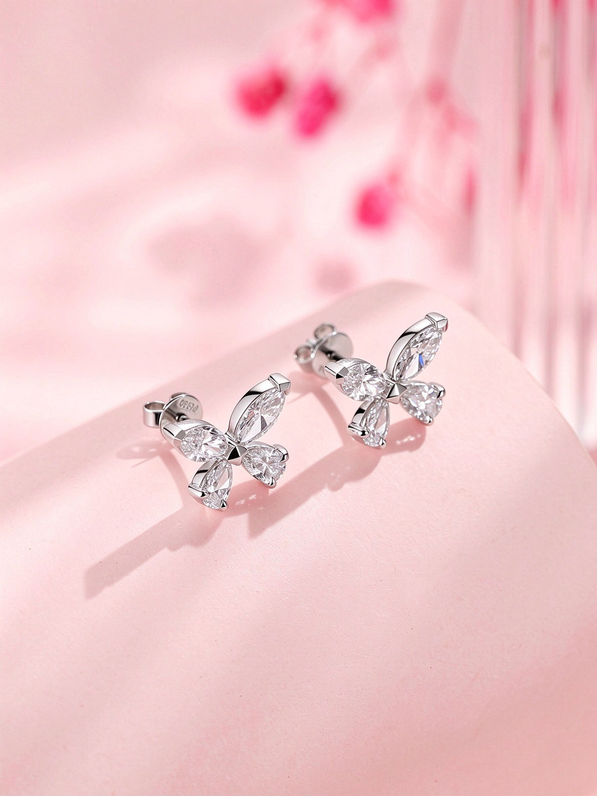 Side view of butterfly diamond studs showing PT950 stamped post