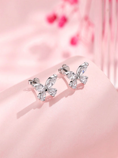 Side view of butterfly diamond studs showing PT950 stamped post