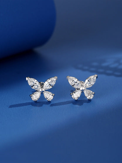 Pair of marquise and pear diamond butterfly studs on deep blue