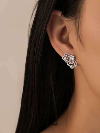 Close-up of Papillon butterfly diamond stud on the earlobe